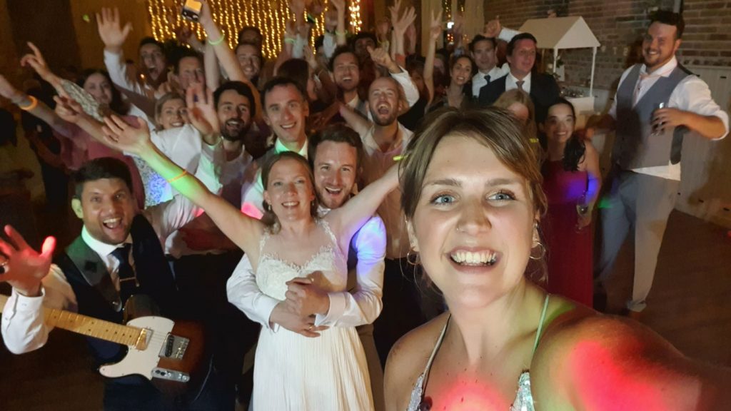 Selfie picture of Alex and Helen wedding crowd