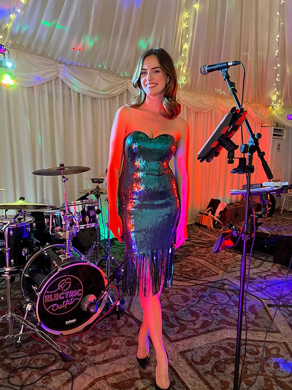 Vocalist Georgie showing of sparkly dress